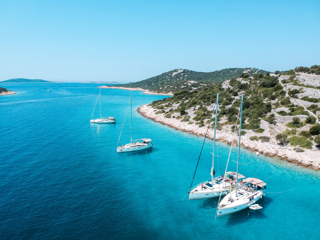 Sailboats lines up along the Croatian coastline